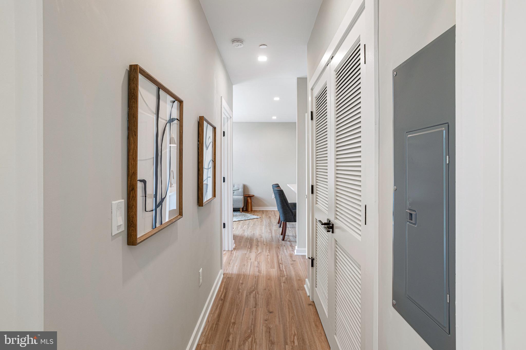 1358 Florida Avenue Northeast, Unit 401 Washington, DC 20002 - Photo 9 of 12 a view of a hallway with wooden floor and staircase
