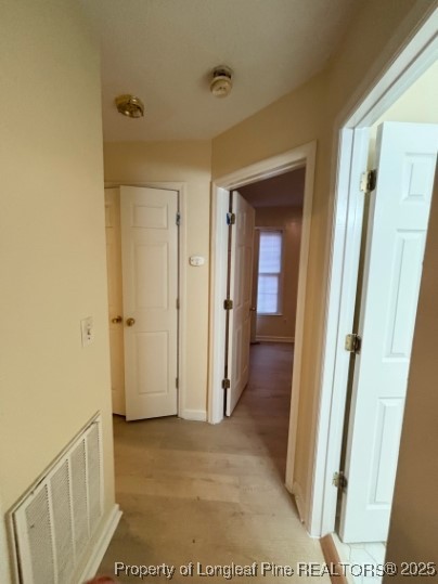 1135 Derbyshire Road Fayetteville, NC 28314 - Photo 14 of 22 a view of a hallway with wooden floor and entryway