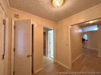 1135 Derbyshire Road Fayetteville, NC 28314 - Photo 15 of 22 a view of a hallway with wooden floor