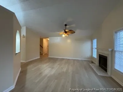 a view of empty room with a fireplace