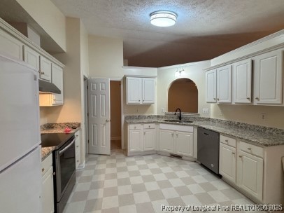 1135 Derbyshire Road Fayetteville, NC 28314 - Photo 5 of 22 a kitchen with a sink stove and cabinets