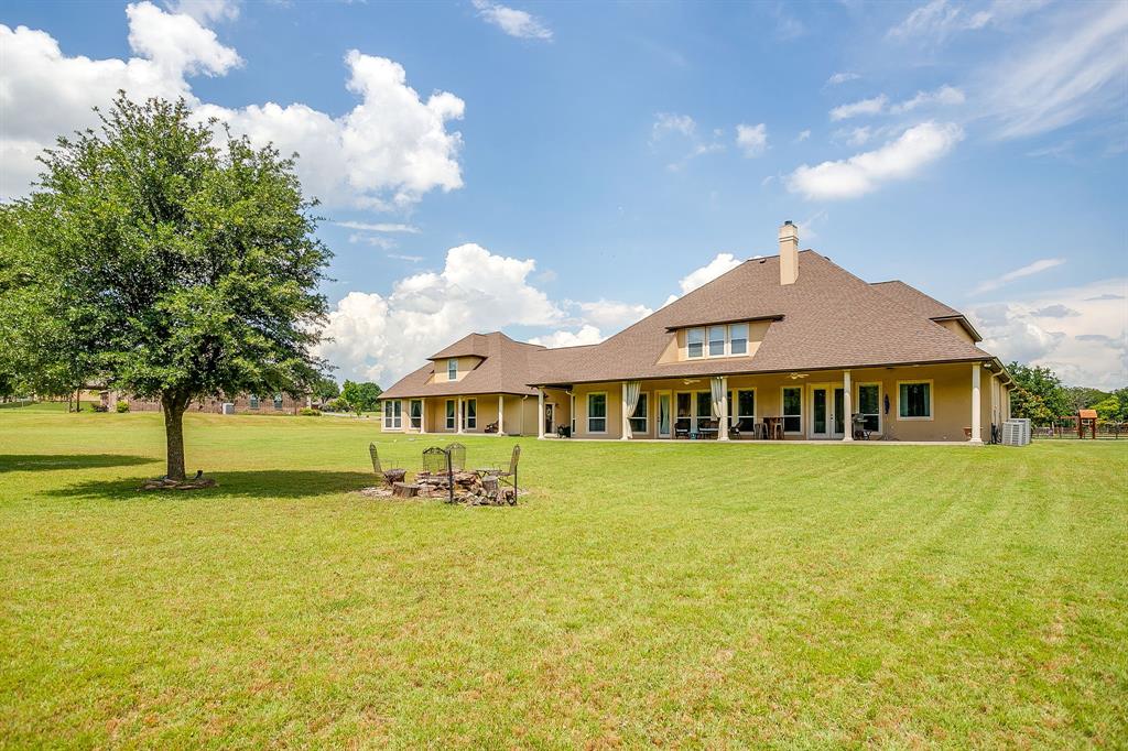 1144 Boling Ranch North Road Azle, TX 76020 - Photo 28 of 40 Backyard patio and fire pit