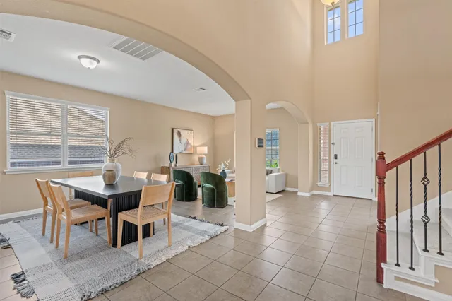 a dining room with furniture and window