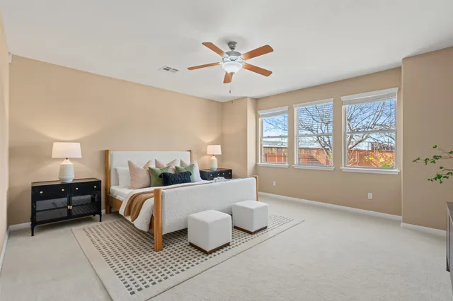 a bedroom with a bed and window