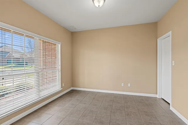 a kitchen with stainless steel appliances granite countertop a refrigerator a stove top oven and a sink with island