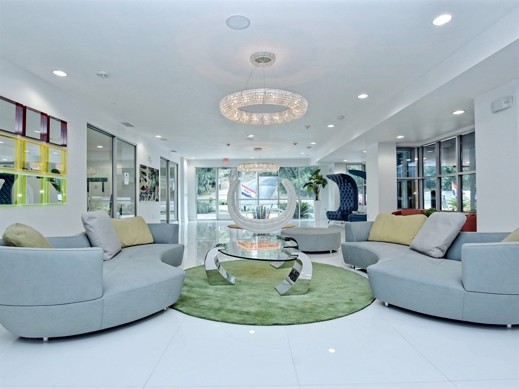 1900 Barton Springs Road, Unit 3040 Austin, TX 78704 - Photo 25 of 38 Spacious reception area featuring a decorative circular chandelier, recessed lighting, and large format white tile flooring