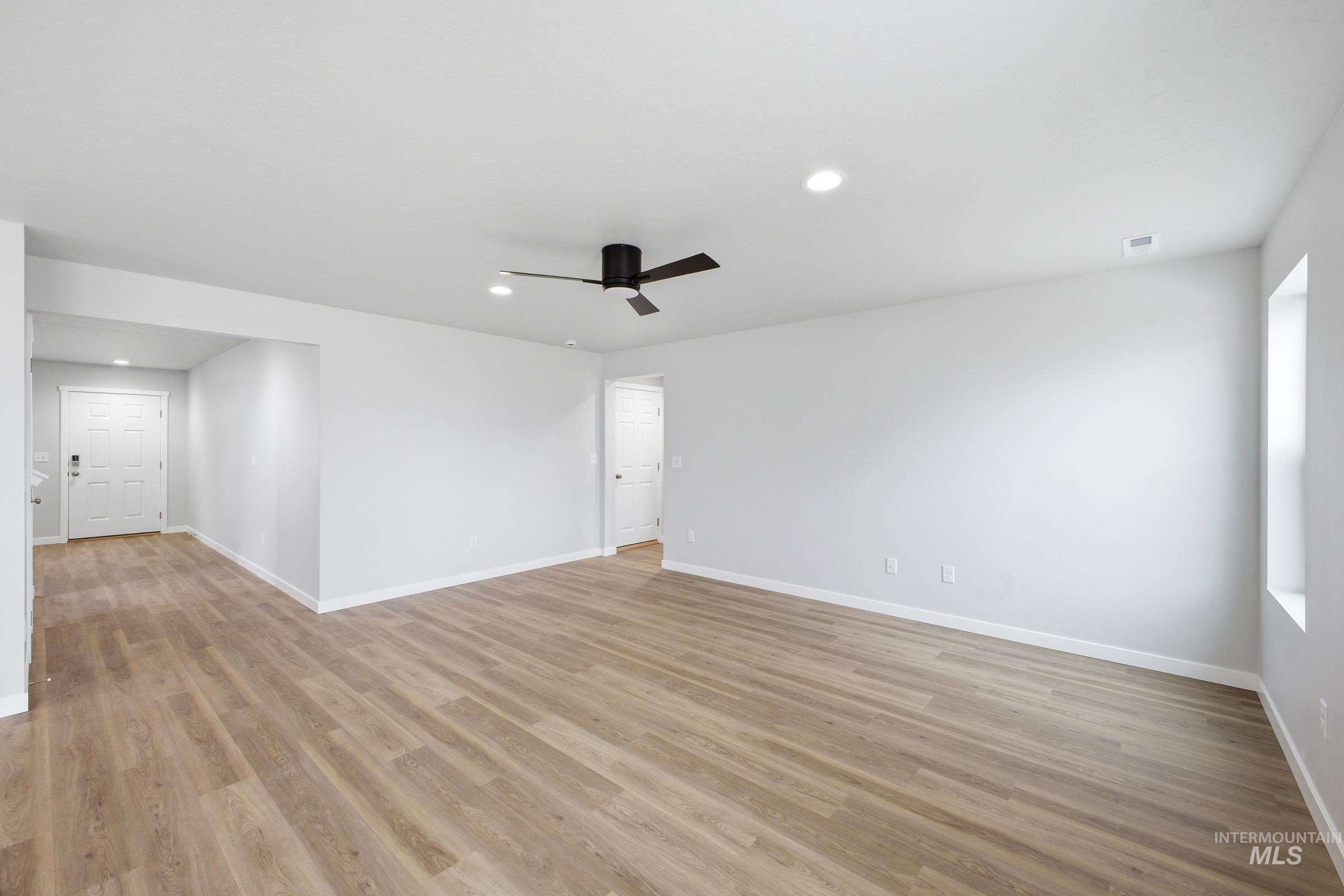13702 Inman Court Caldwell, ID 83607 - Photo 8 of 23 Spare room featuring recessed lighting, ceiling fan, and light wood-style floors
