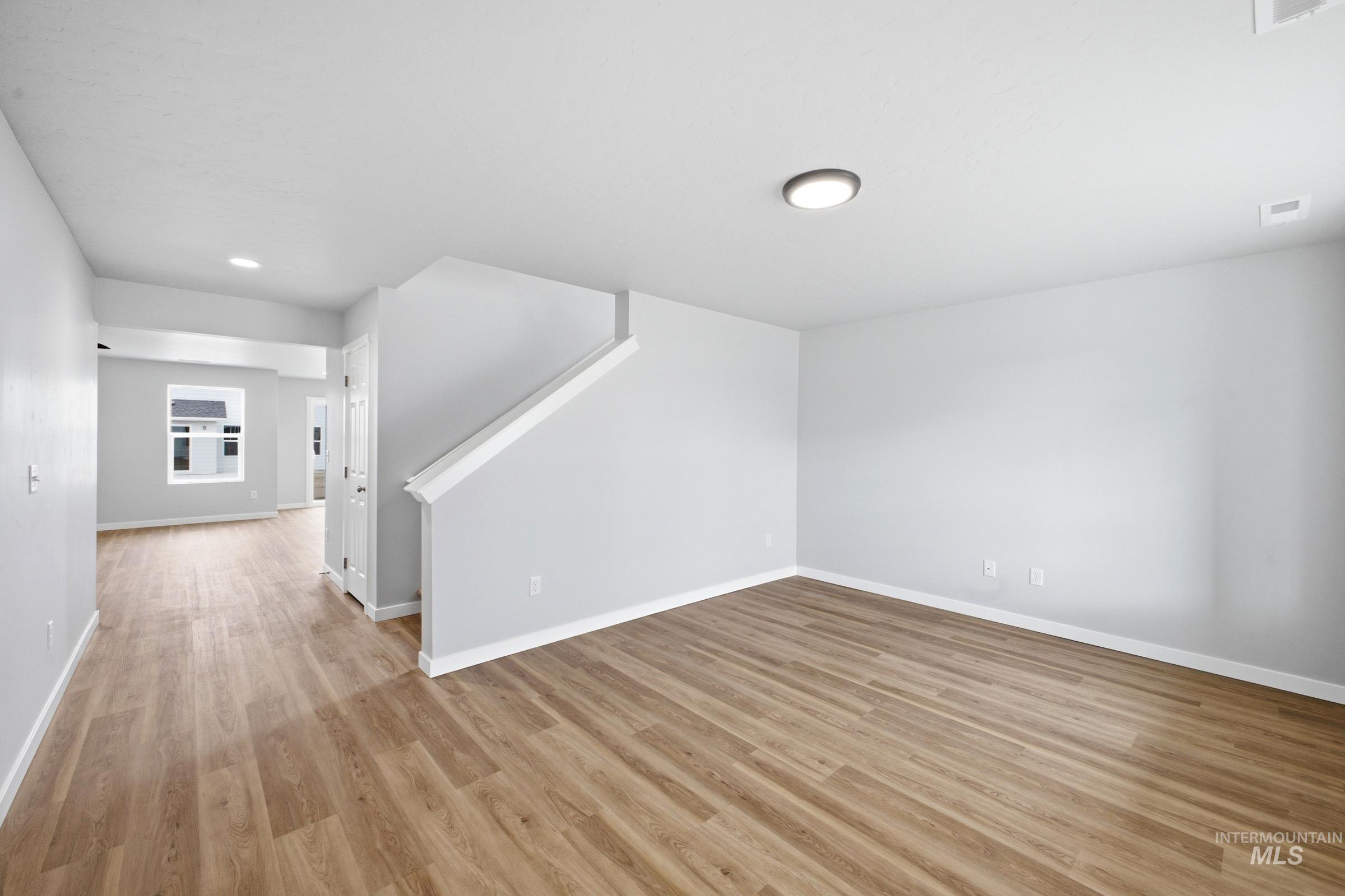 13702 Inman Court Caldwell, ID 83607 - Photo 10 of 23 Unfurnished room with light wood-type flooring and recessed lighting