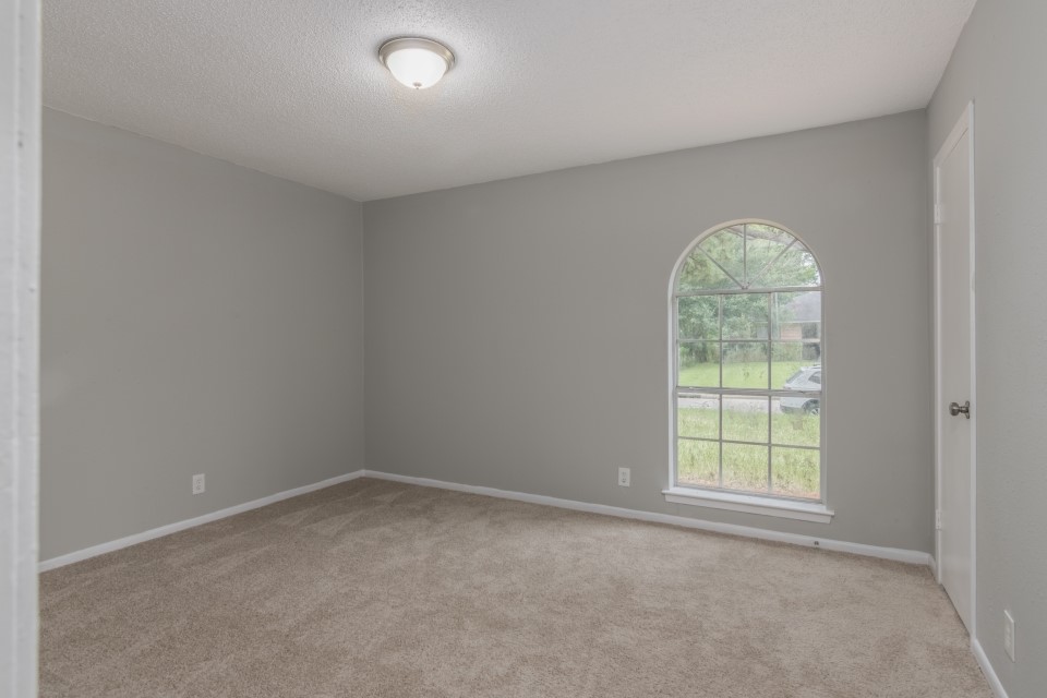 92 Sparrow Way Beaumont, TX 77707 - Photo 12 of 19 an empty room with a window