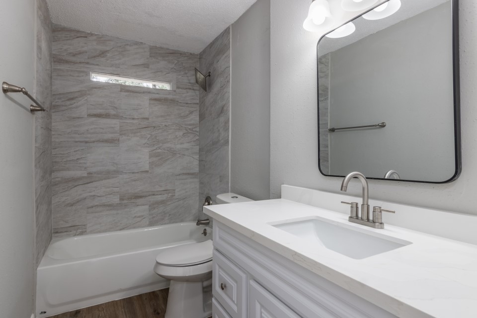 92 Sparrow Way Beaumont, TX 77707 - Photo 14 of 19 a bathroom with a sink a toilet and shower