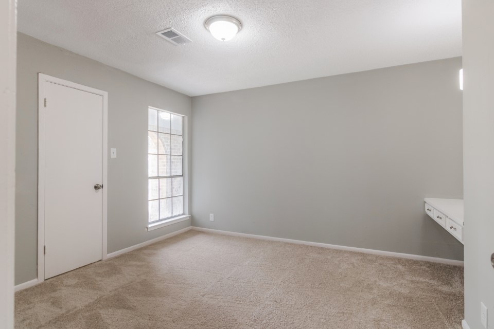 92 Sparrow Way Beaumont, TX 77707 - Photo 15 of 19 an empty room with windows
