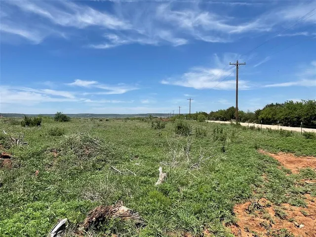 a view of a yard with an ocean beach