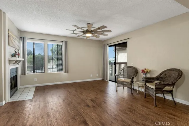 a view of a livingroom with furniture and a ceiling fan or hardwood floor