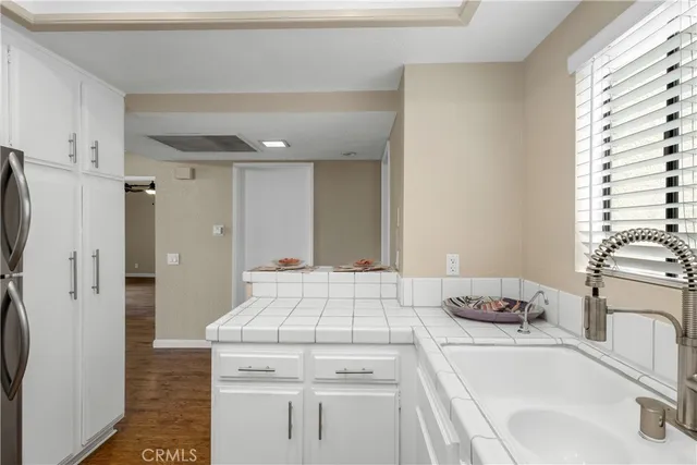 a kitchen with a sink stove and refrigerator