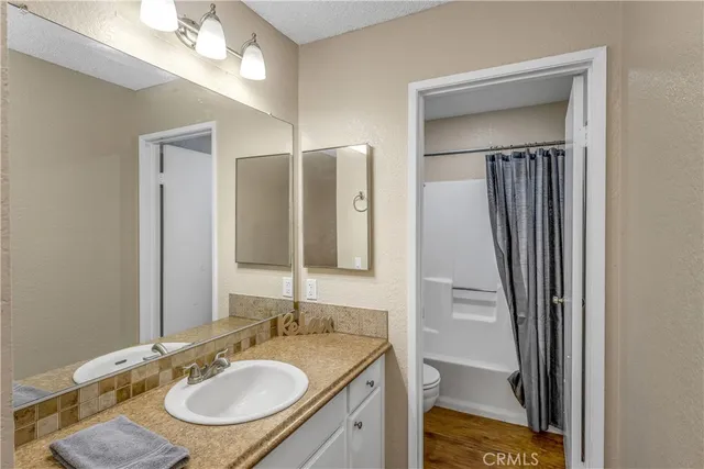 a bathroom with a sink double vanity and a mirror