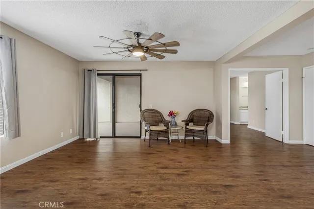 a view of a livingroom with furniture and chandelier
