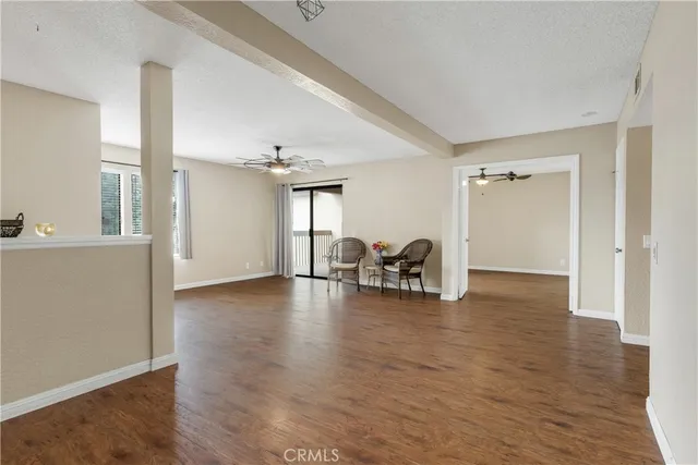 a view of a livingroom with furniture and white walls