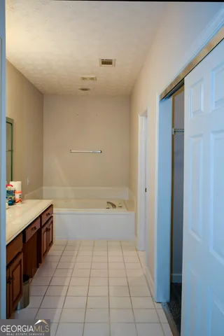 a bathroom with a sink double vanity and a mirror