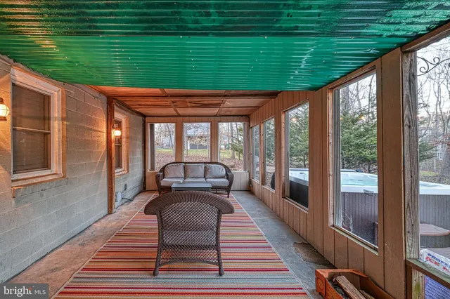 a view of an chairs and table in the balcony