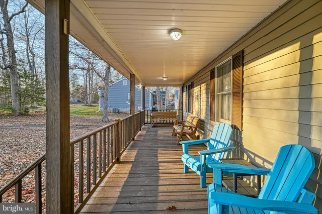 a view of a balcony with wooden floor