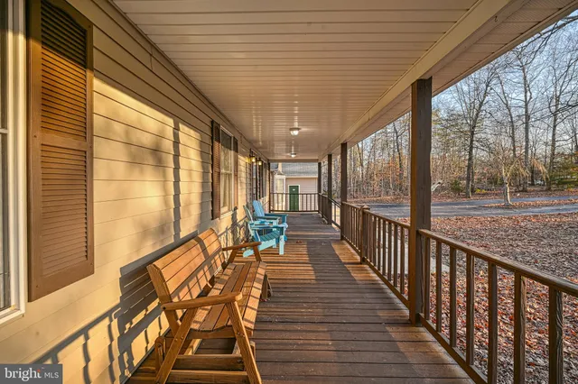 a bathroom with a granite countertop double vanity sink and a mirror