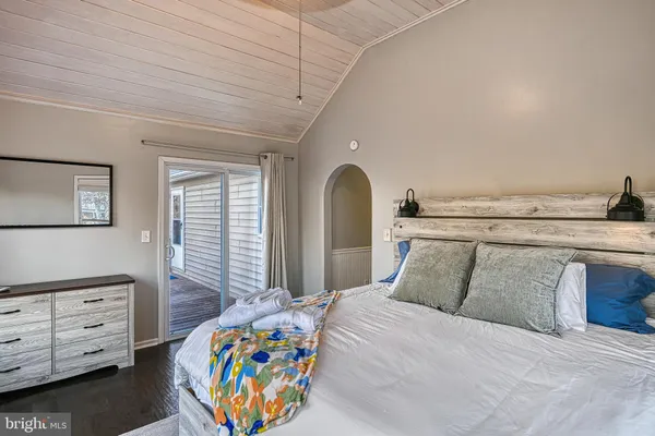 a bedroom with a bed and a dresser