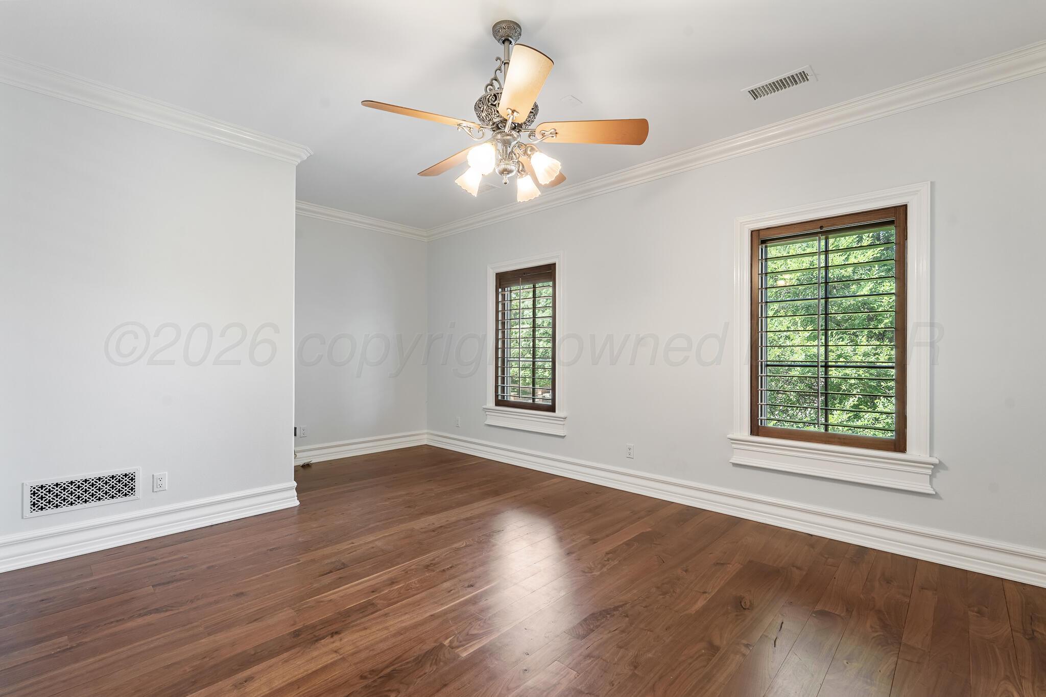 18 Cypress Point Amarillo, TX 79124 - Photo 72 of 95 a view of an empty room with wooden floor and a window