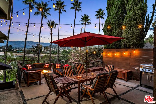 a view of a chairs and table in the patio