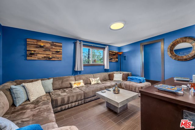 a open kitchen with stainless steel appliances granite countertop a refrigerator and a stove top oven