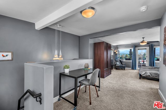 a bathroom with a sink a toilet a mirror and shower