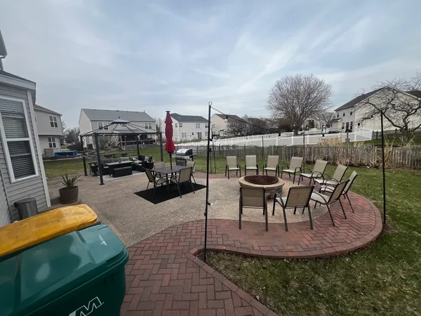 a view of a swimming pool with chairs