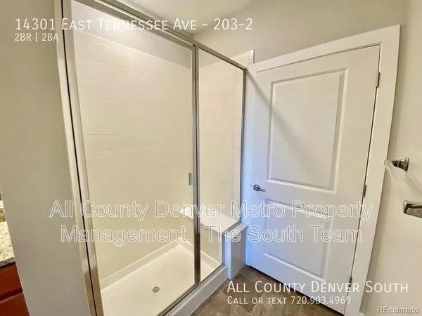a bathroom with a shower and a tub