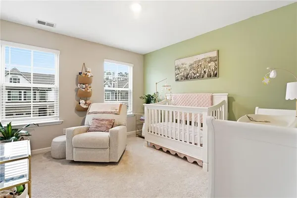 a bedroom with a bed and a couch