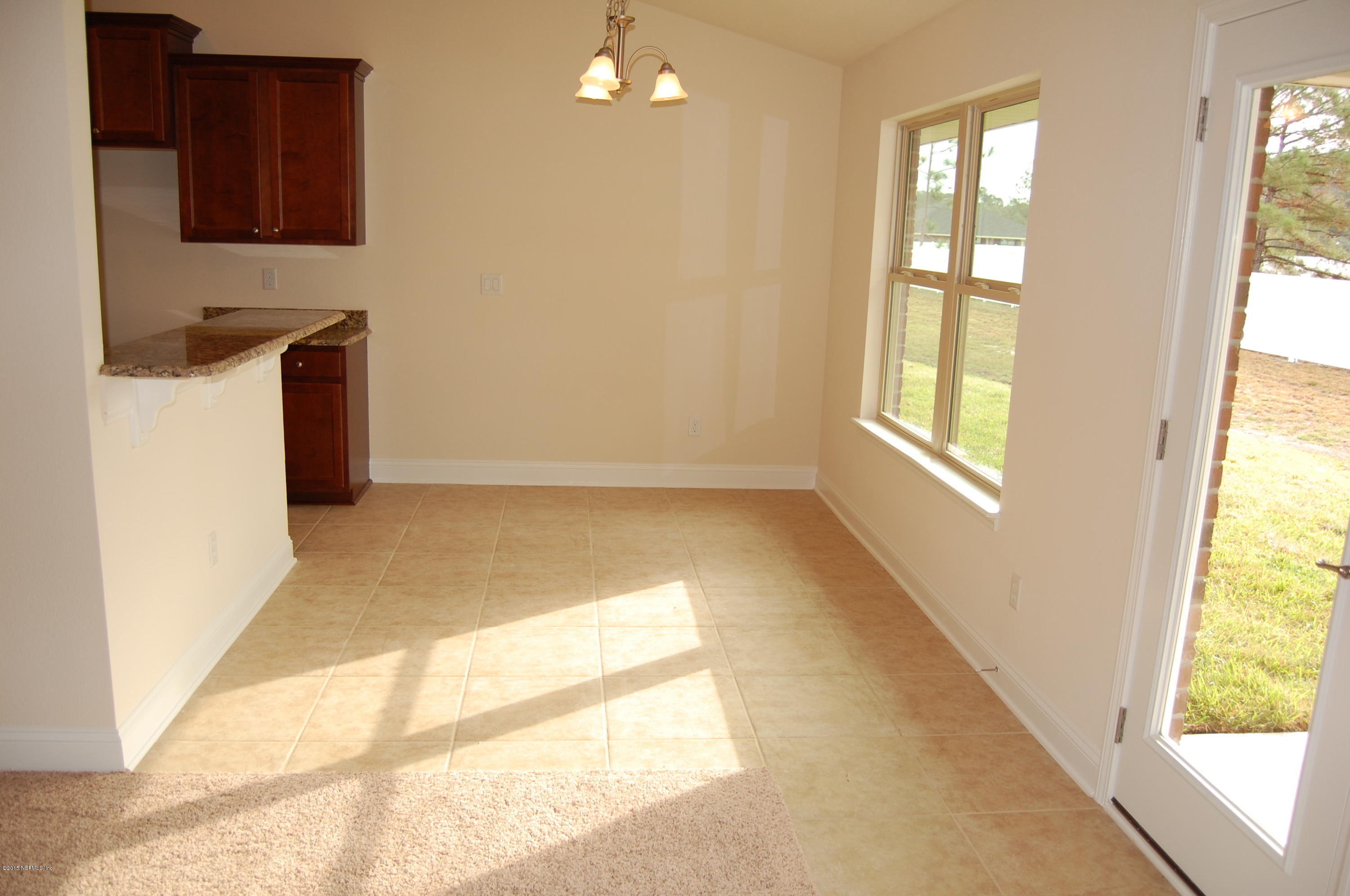 8000 Capeside Way Jacksonville, FL 32222 - Photo 12 of 32 a view of an empty room and window