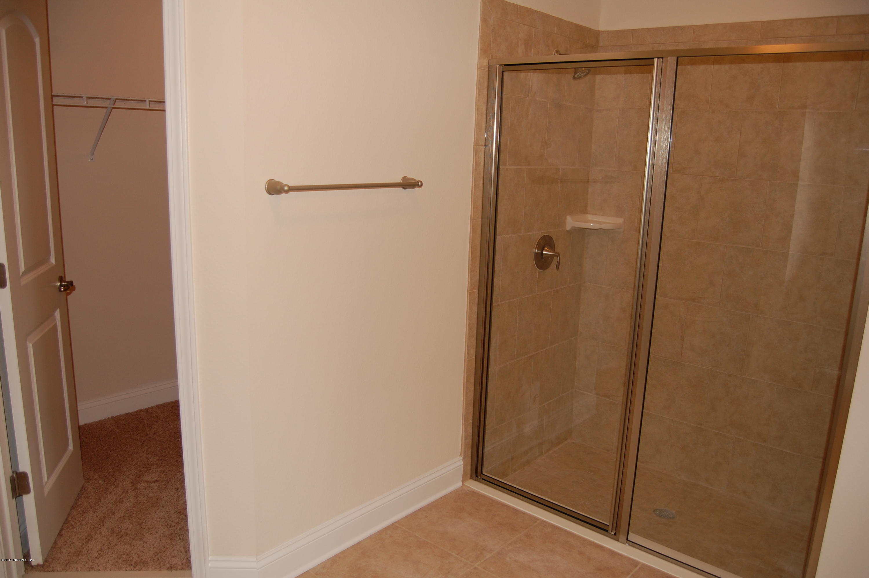 8000 Capeside Way Jacksonville, FL 32222 - Photo 21 of 32 a bathroom with a glass shower door