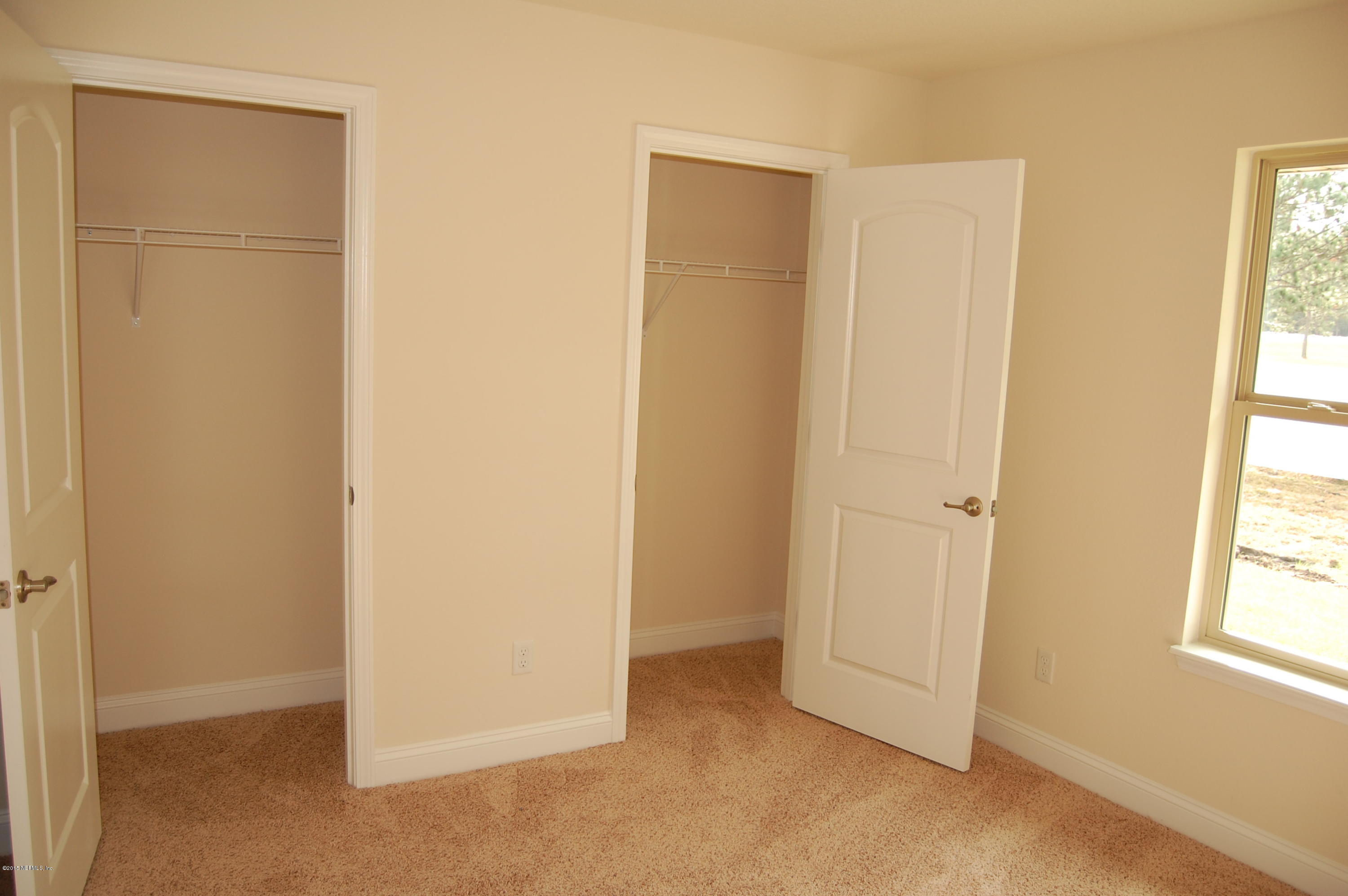 8000 Capeside Way Jacksonville, FL 32222 - Photo 26 of 32 a view of an empty room with a window