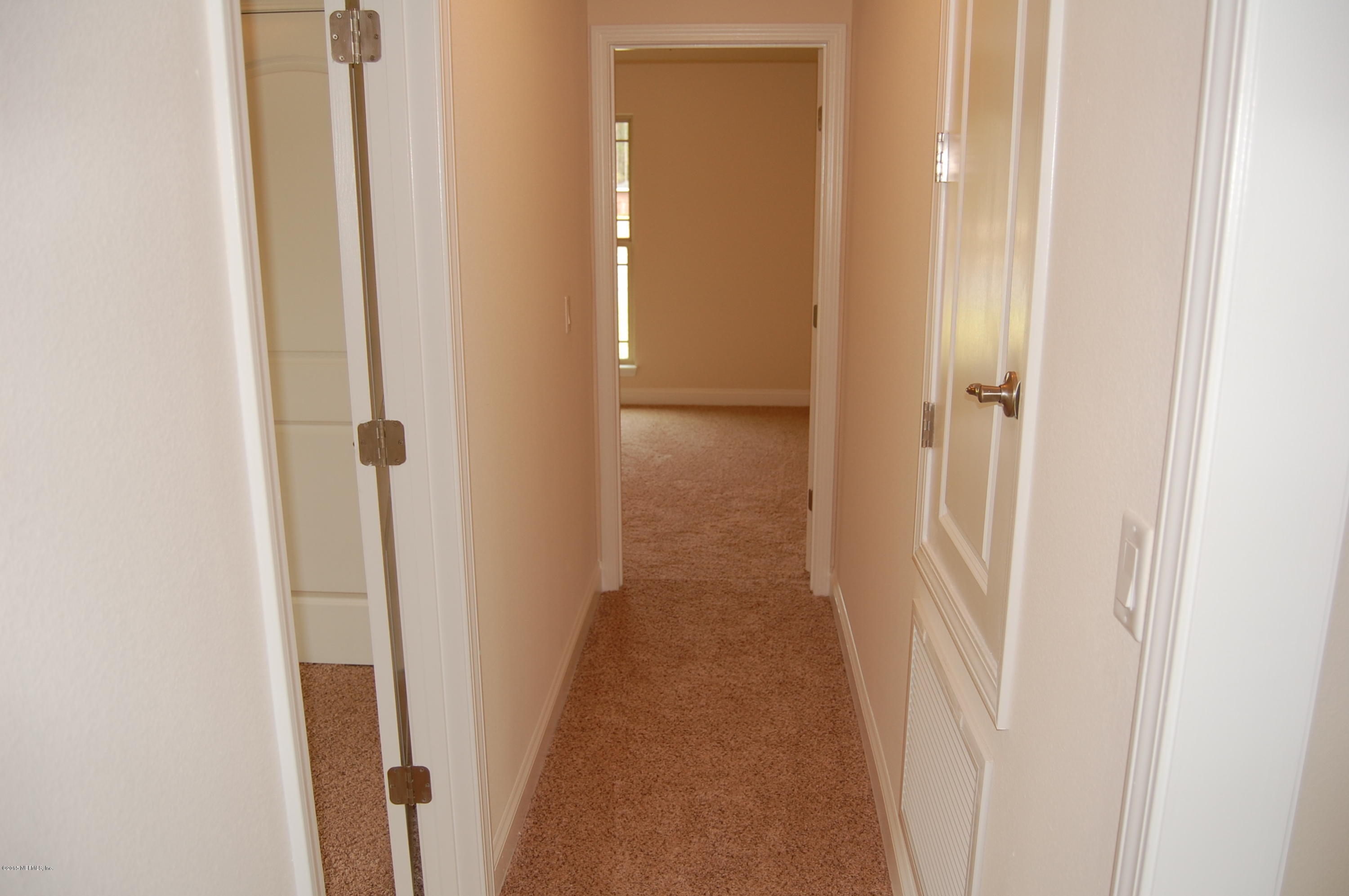8000 Capeside Way Jacksonville, FL 32222 - Photo 28 of 32 a view of a hallway with wooden floor