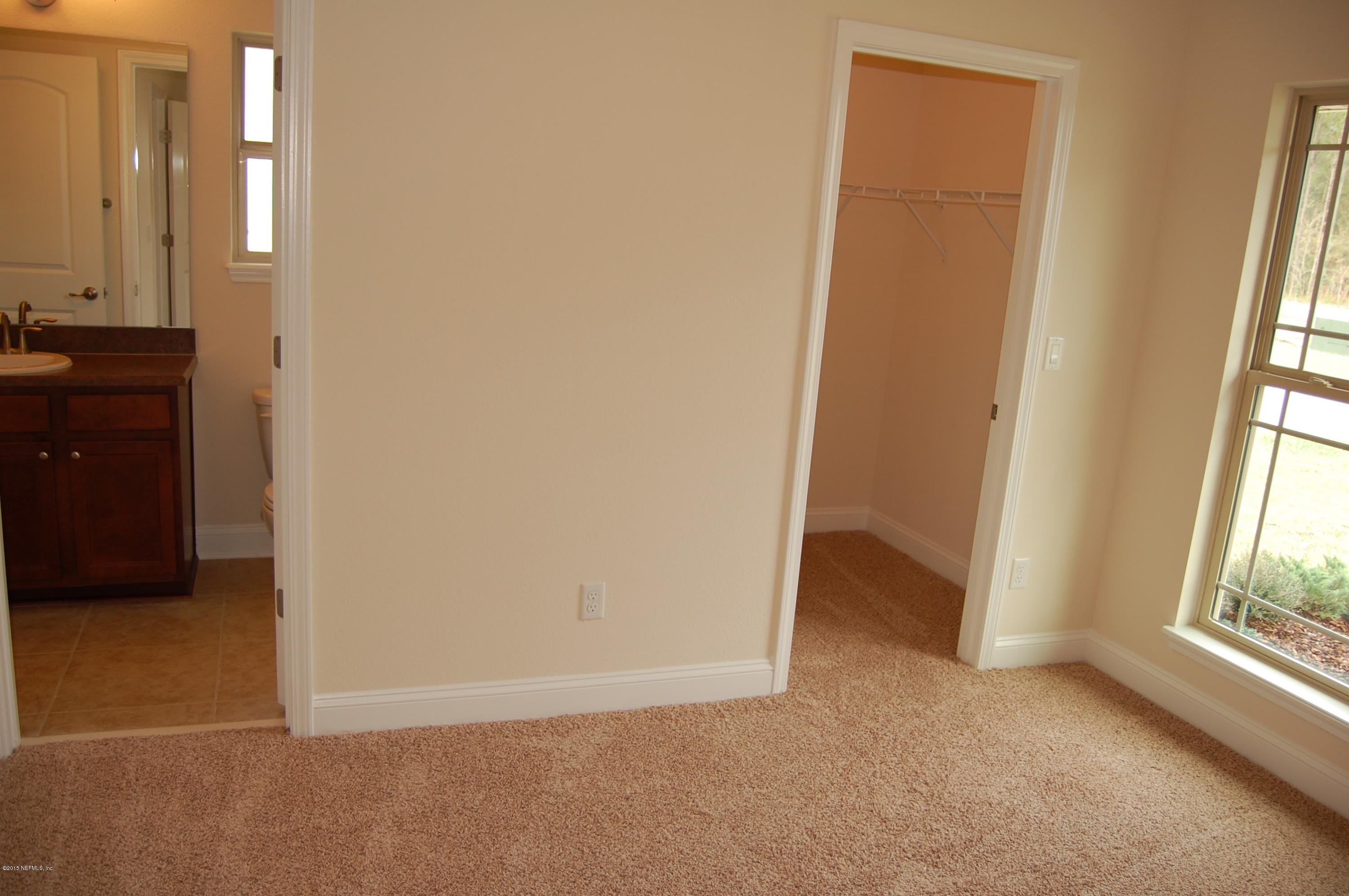 8000 Capeside Way Jacksonville, FL 32222 - Photo 31 of 32 an empty room with windows