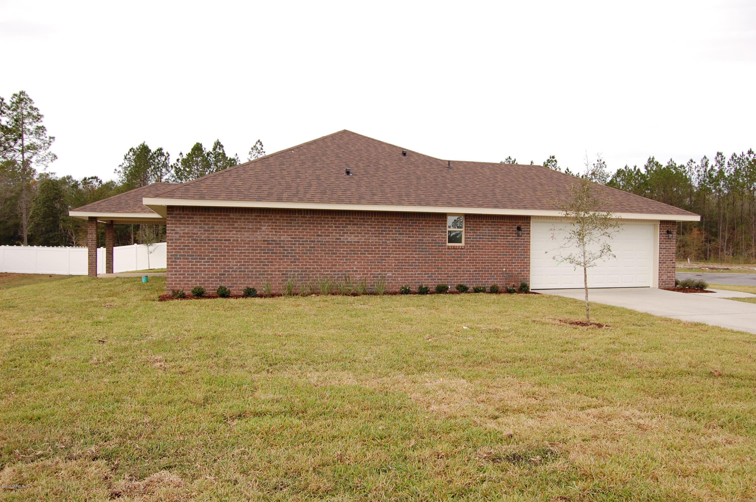 8000 Capeside Way Jacksonville, FL 32222 - Photo 4 of 32 a house view with a garden space