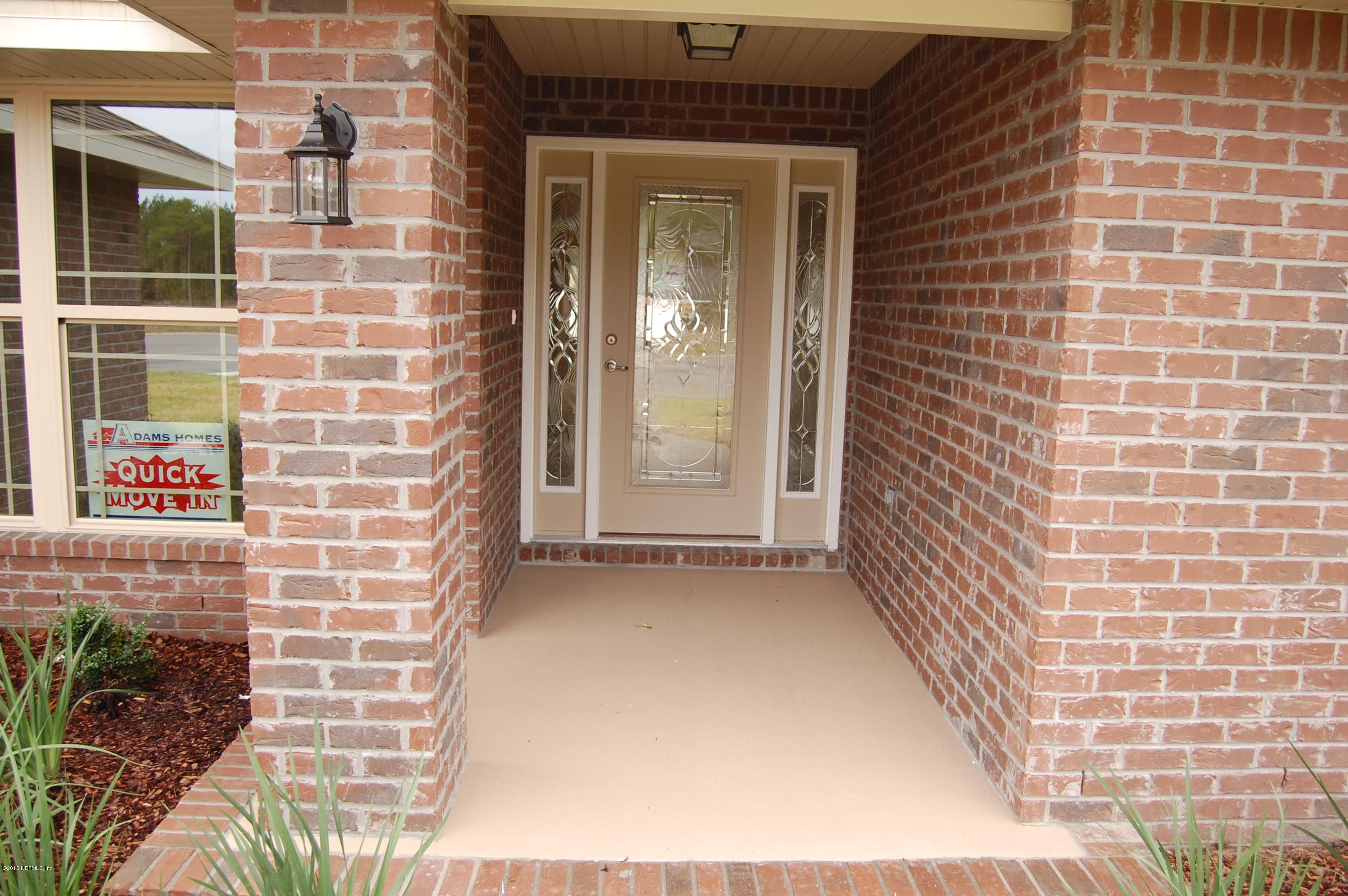 8000 Capeside Way Jacksonville, FL 32222 - Photo 7 of 32 a view of a brick house with front door