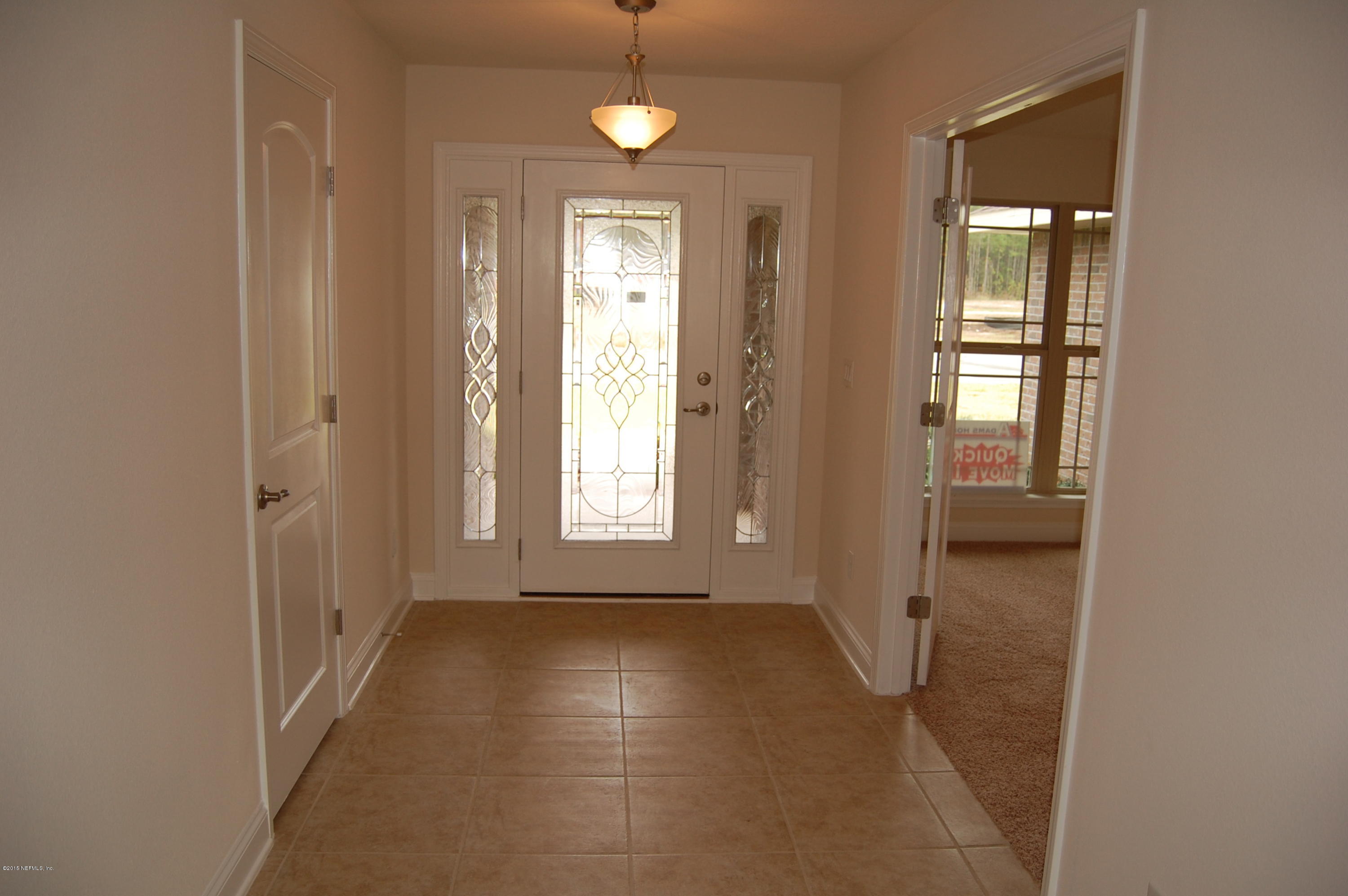 8000 Capeside Way Jacksonville, FL 32222 - Photo 8 of 32 an empty room with windows and closet