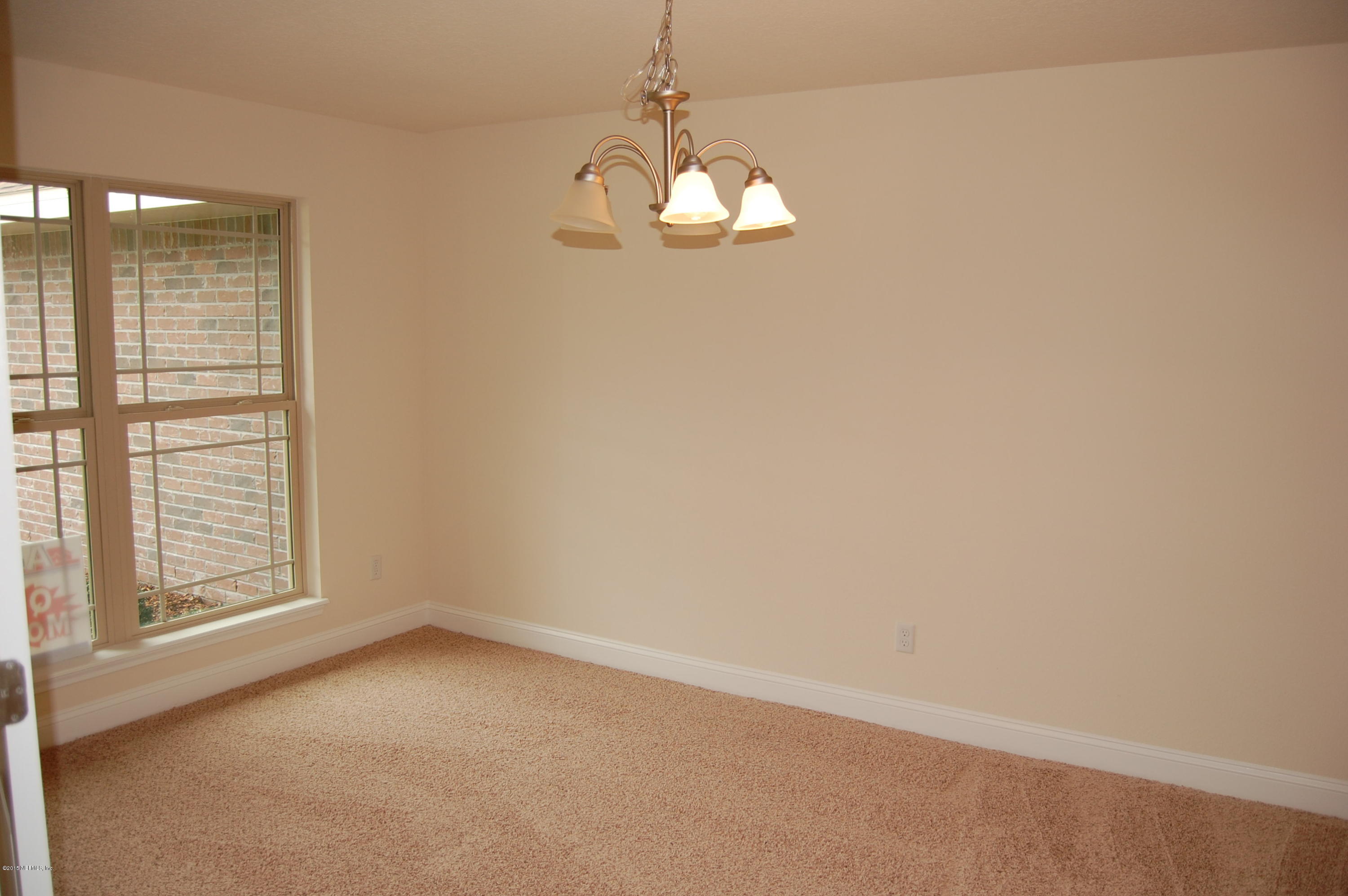 8000 Capeside Way Jacksonville, FL 32222 - Photo 9 of 32 a view of empty room with window