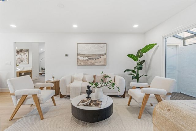 a living room with furniture and a table
