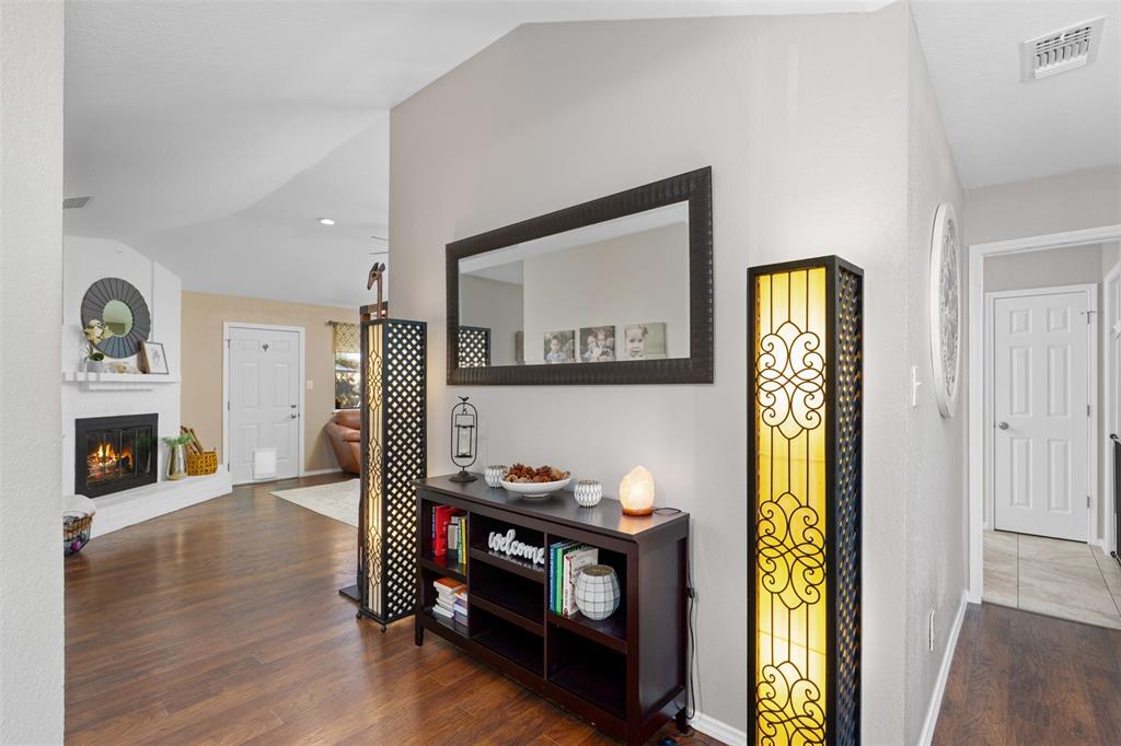10159 Powderhorn Road Fort Worth, TX 76108 - Photo 3 of 21 a living room with furniture and a fireplace