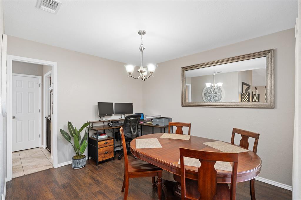 10159 Powderhorn Road Fort Worth, TX 76108 - Photo 8 of 21 a view of a dining room with furniture and wooden floor
