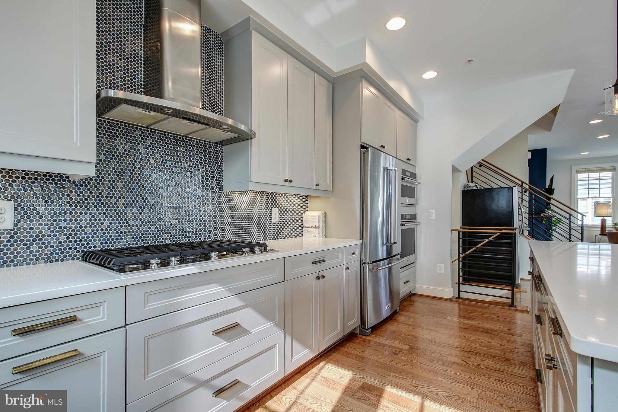 44 Ellsworth Heights Street Silver Spring, MD 20910 - Photo 18 of 42 Gas cooktop with stainless hood