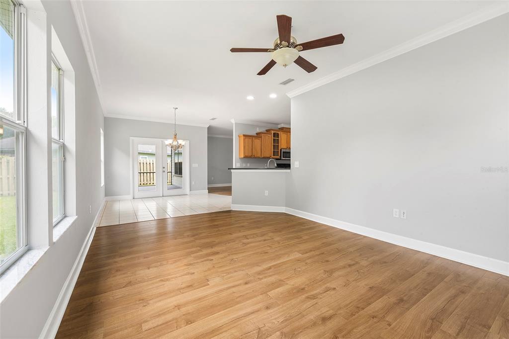 8376 Southwest 80th Place Gainesville, FL 32608 - Photo 11 of 37 wooden floor in an empty room with a window