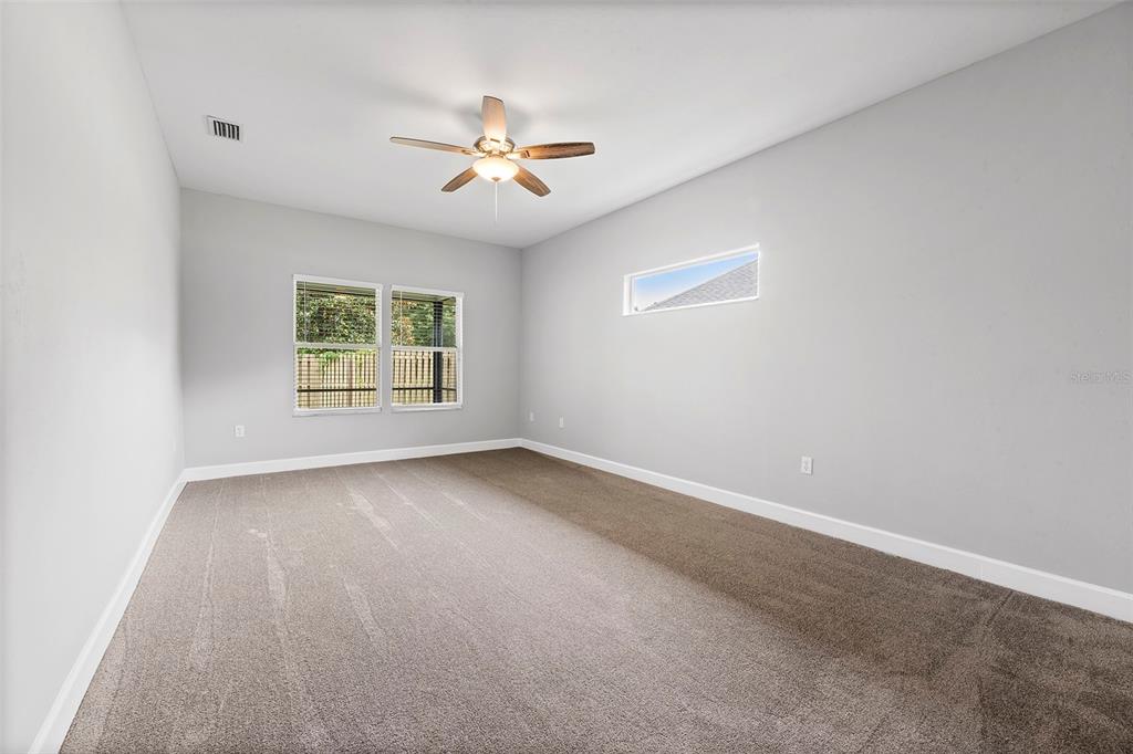 8376 Southwest 80th Place Gainesville, FL 32608 - Photo 15 of 37 an empty room with a window