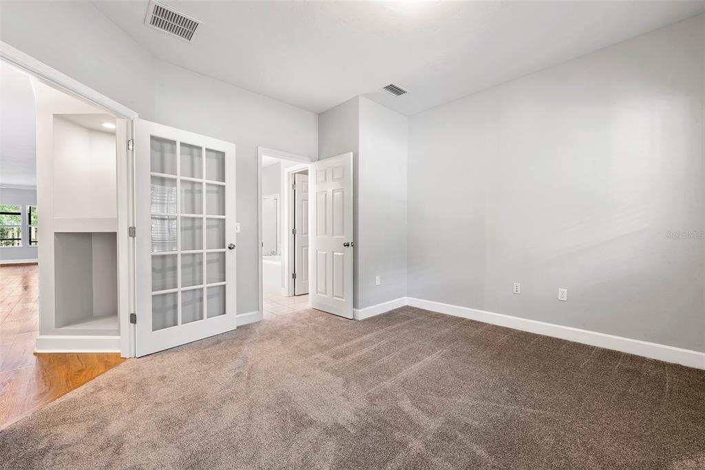 8376 Southwest 80th Place Gainesville, FL 32608 - Photo 20 of 37 an empty room with windows
