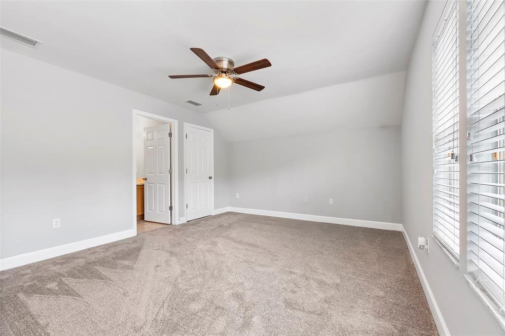 8376 Southwest 80th Place Gainesville, FL 32608 - Photo 24 of 37 a view of an empty room with a window